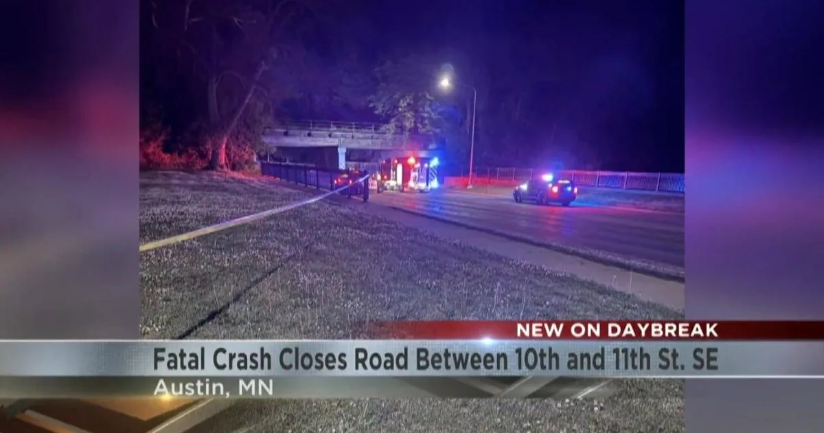 Police investigate a fatal crash site near a bridge support in Austin, Minnesota